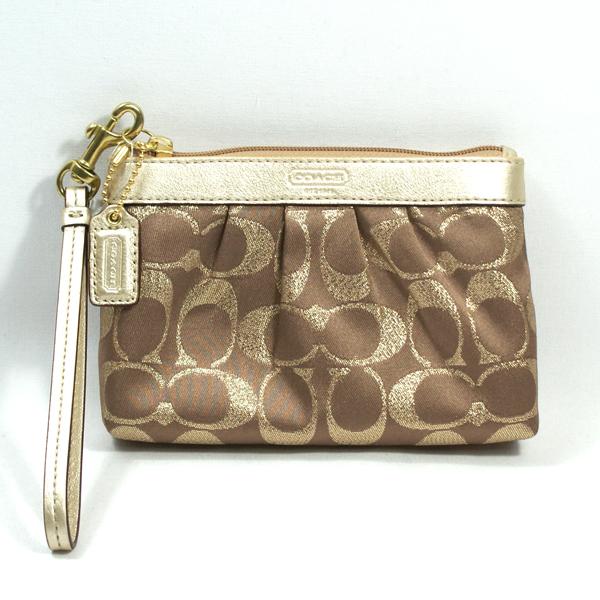 gold coach wristlets