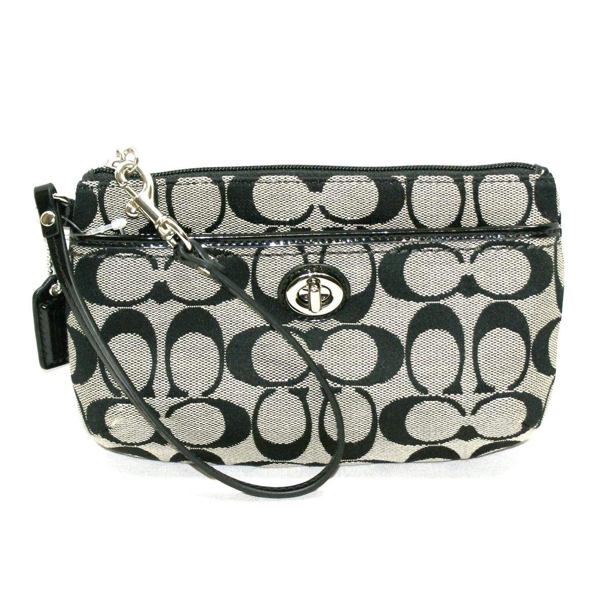 black and white coach backpack